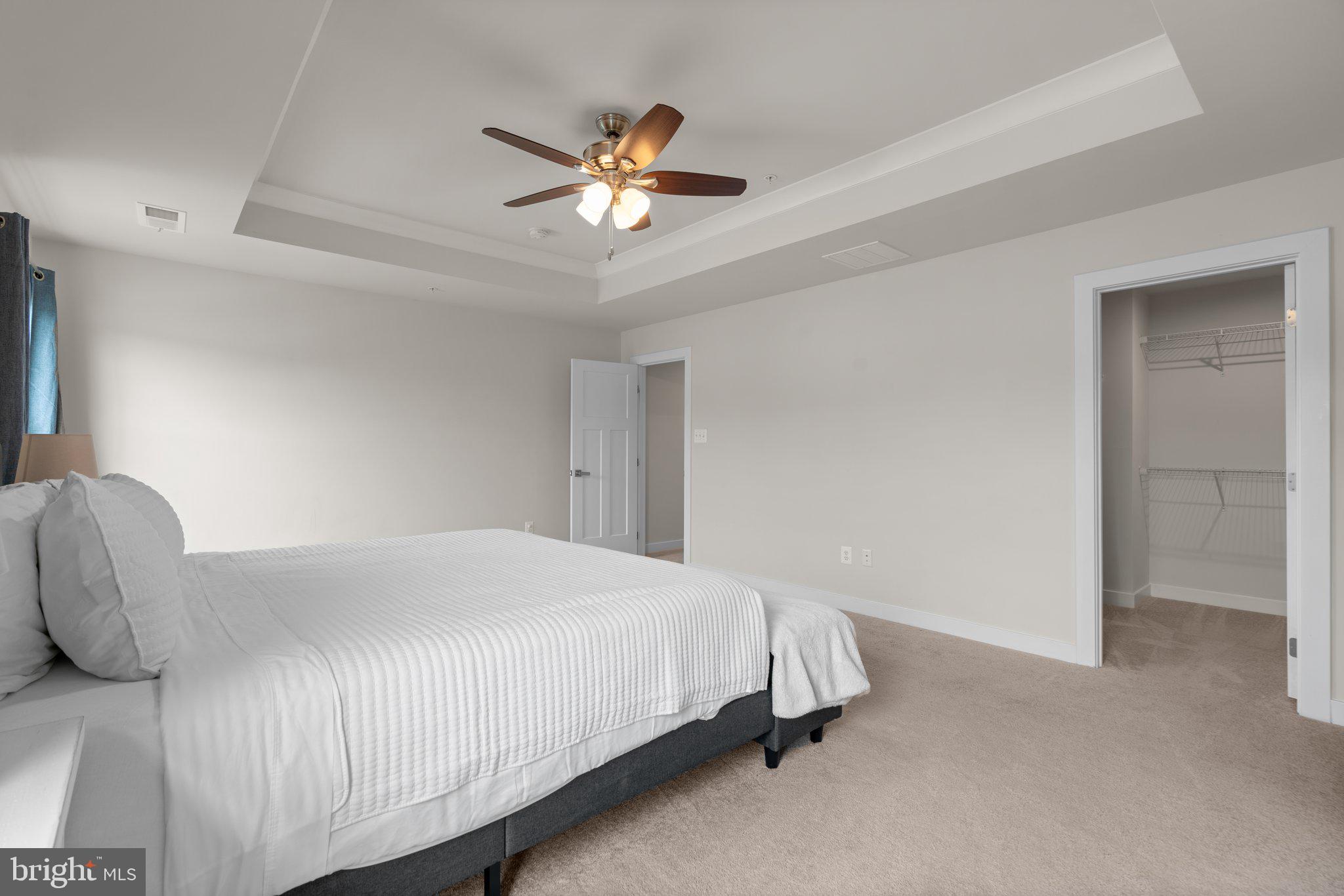 3150 Dodder Way Odenton, MD 21113 - Photo 21 of 83 a bedroom with a bed and a chandelier
