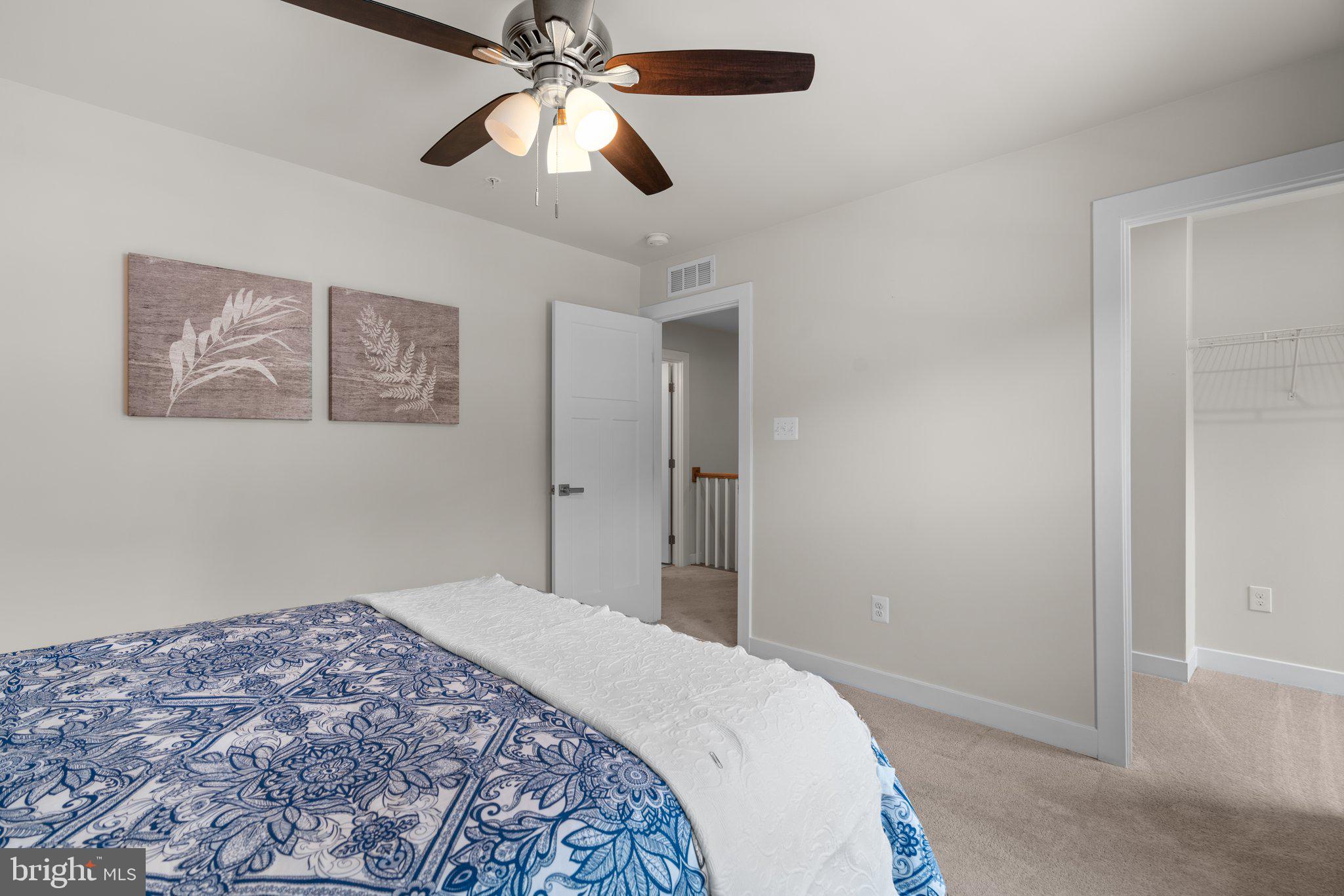 3150 Dodder Way Odenton, MD 21113 - Photo 31 of 83 a bedroom with a bed and a chandelier