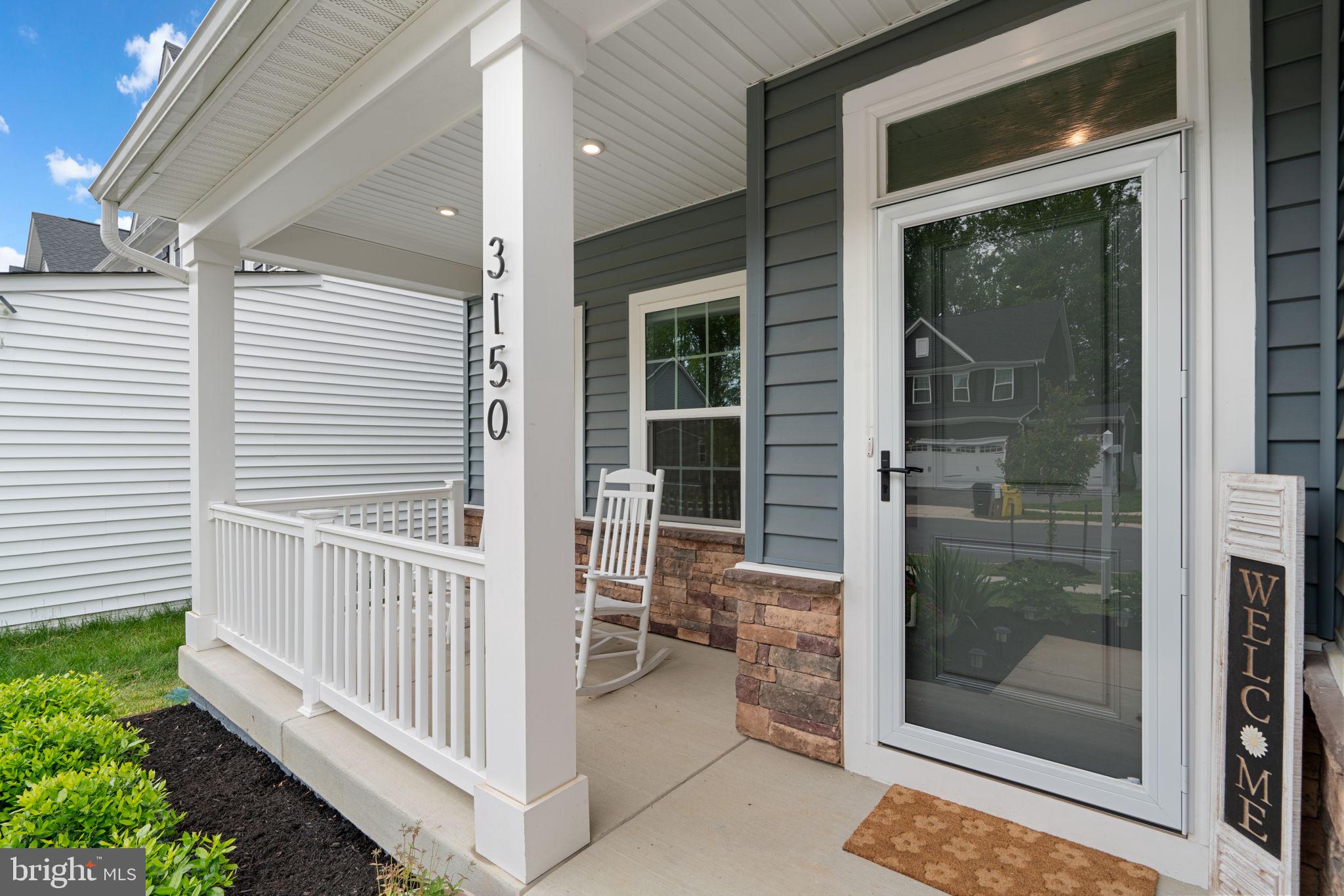 3150 Dodder Way Odenton, MD 21113 - Photo 4 of 83 a view of a porch with a door