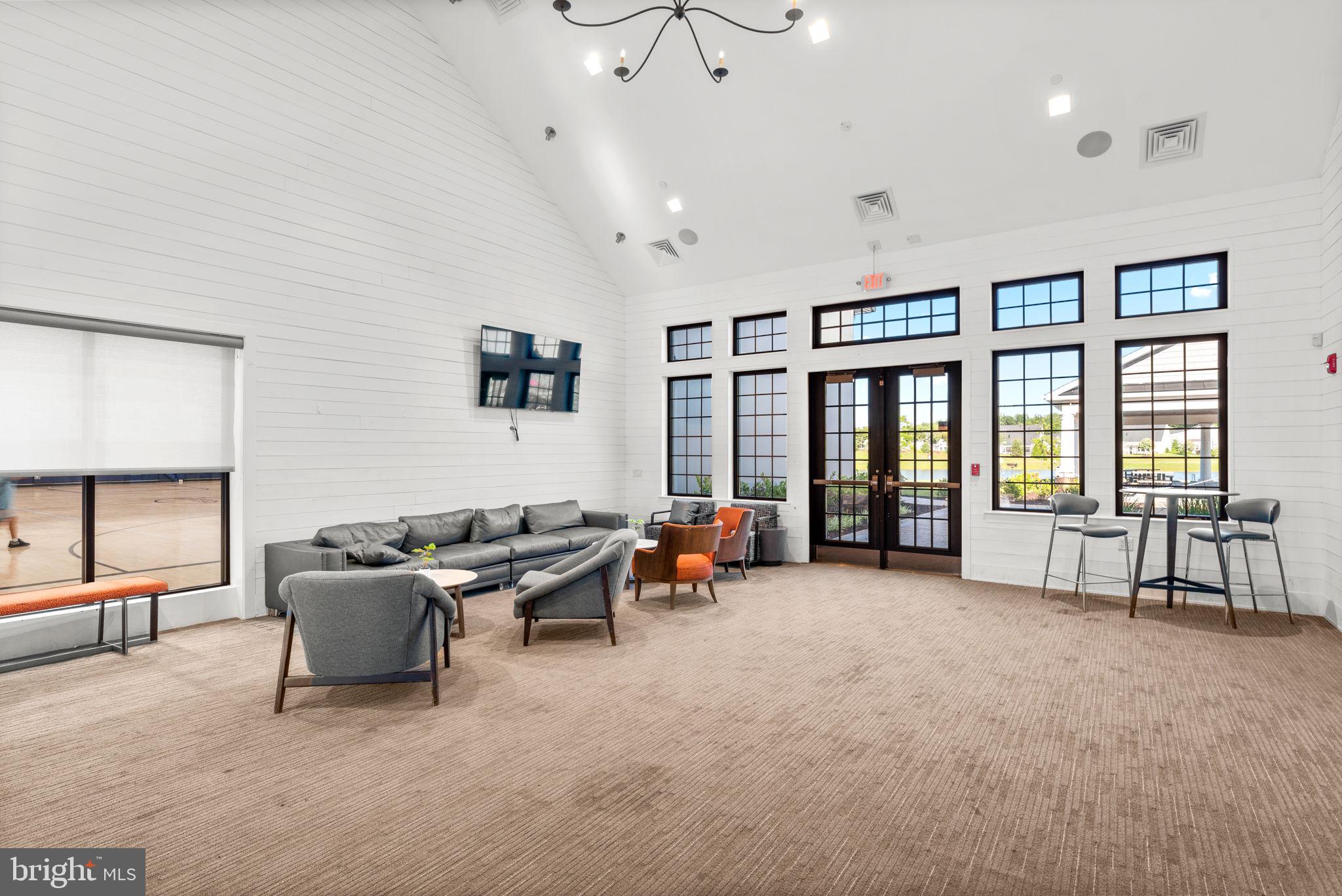 3150 Dodder Way Odenton, MD 21113 - Photo 57 of 83 a living room with furniture and large windows