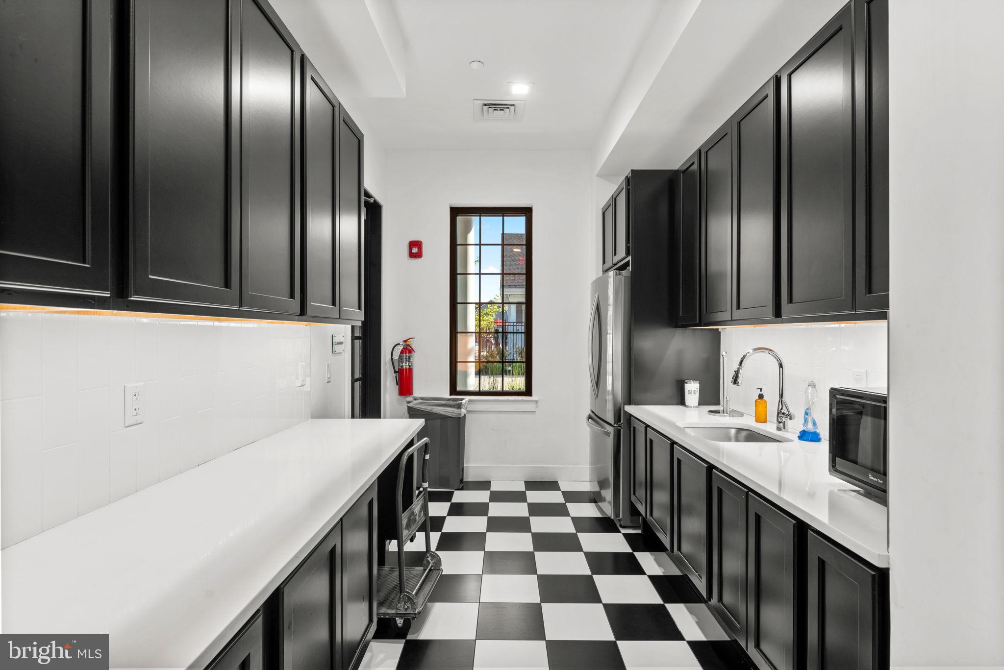3150 Dodder Way Odenton, MD 21113 - Photo 59 of 83 a kitchen with granite countertop stainless steel appliances a sink stove top oven and cabinets