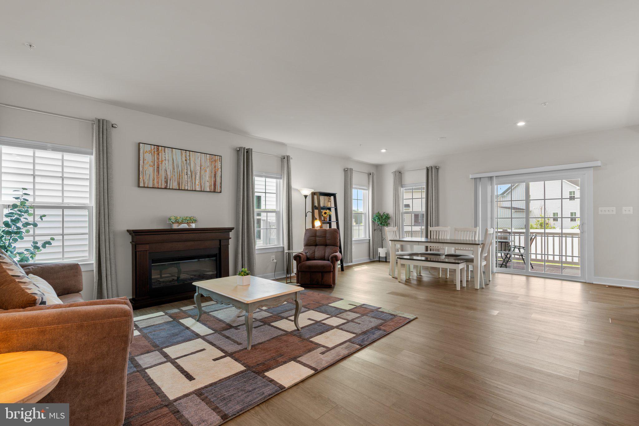 3150 Dodder Way Odenton, MD 21113 - Photo 7 of 83 a living room with furniture and a fireplace