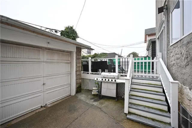 a view of a patio with a table and chairs