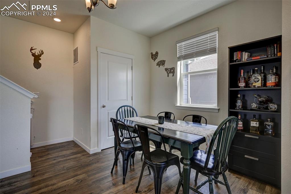 45780 Silverdrop Avenue Bennett, CO 80102 - Photo 17 of 43 a view of a dining room with furniture and window