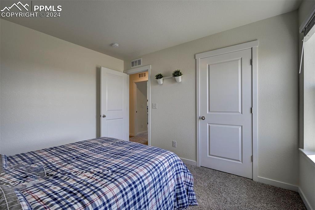 45780 Silverdrop Avenue Bennett, CO 80102 - Photo 30 of 43 a bedroom with a bed and a window