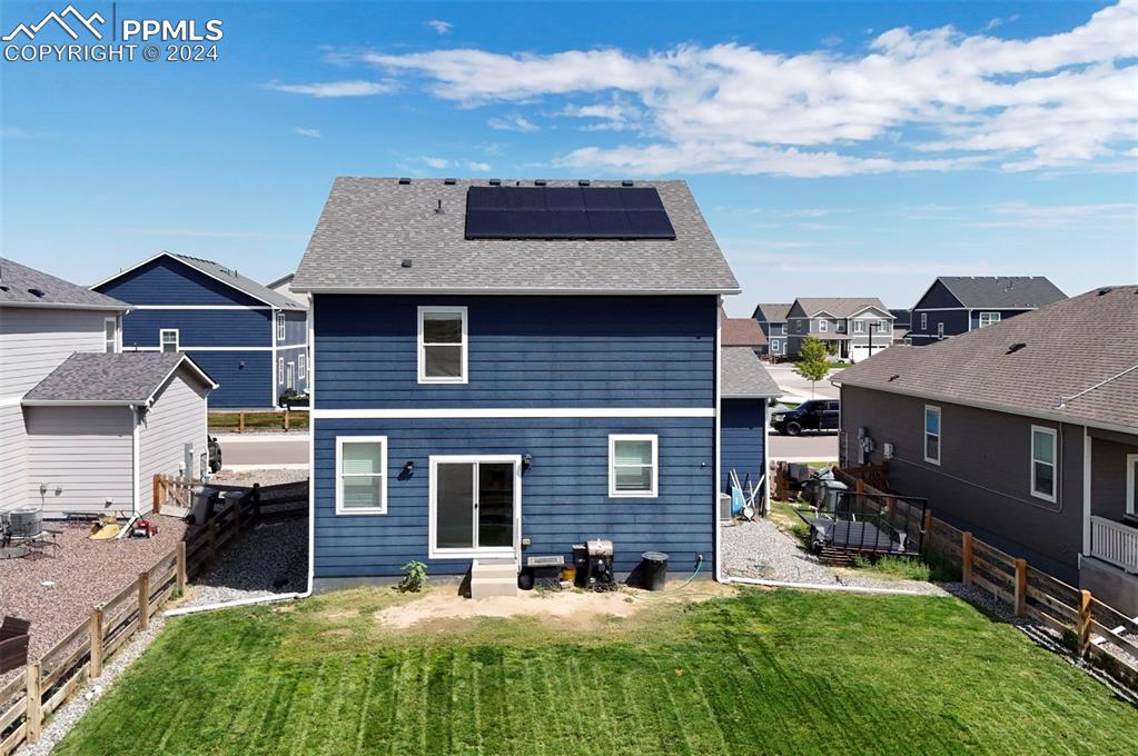 45780 Silverdrop Avenue Bennett, CO 80102 - Photo 37 of 43 a view of a house with a yard porch and sitting area