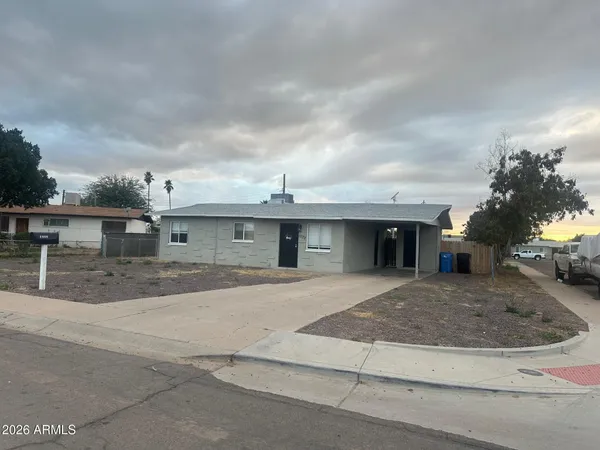 a view of a house with a street