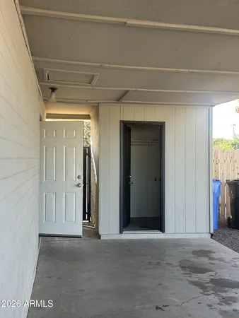 a view of a yard that has a lot of car parked on the road