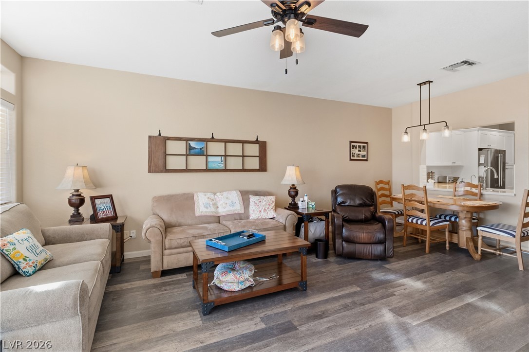 3350 Pheasant Canyon Way, Unit 1008 Laughlin, NV 89029 - Photo 9 of 80 Living room with dark wood-style vinyl plank flooring and a ceiling fan
