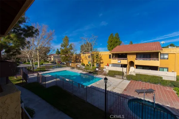 a view of a patio with swimming pool