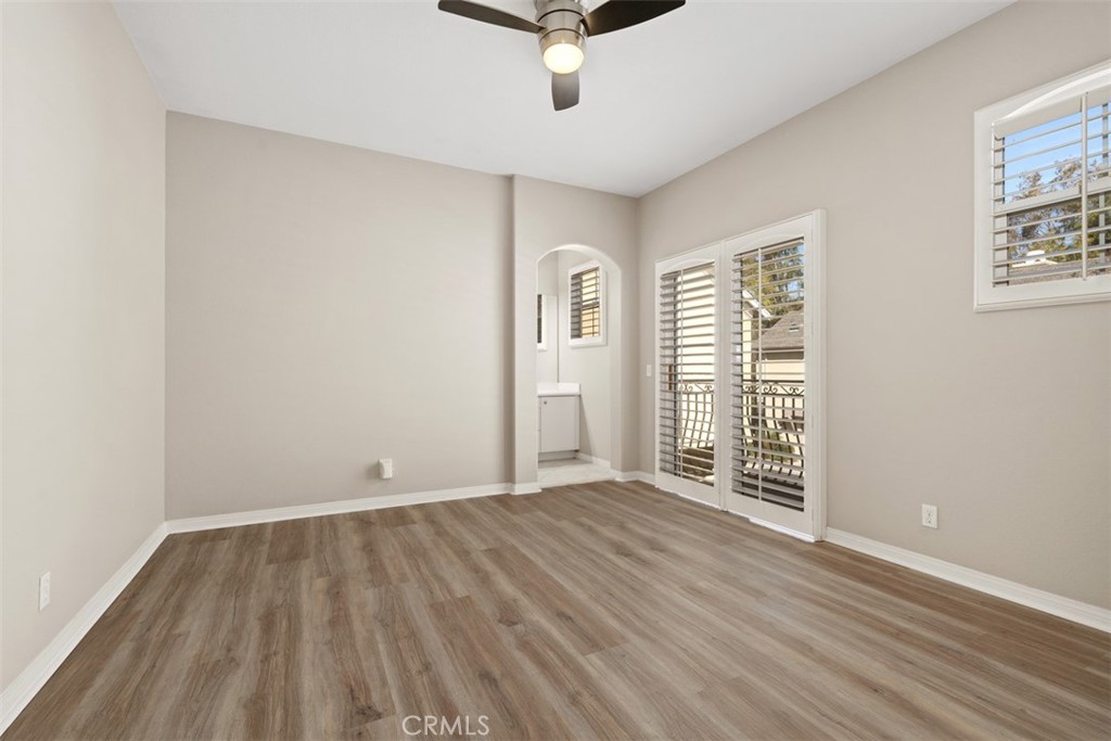 61 Burlingame Irvine, CA 92602 - Photo 11 of 13 wooden floor in an empty room with a window