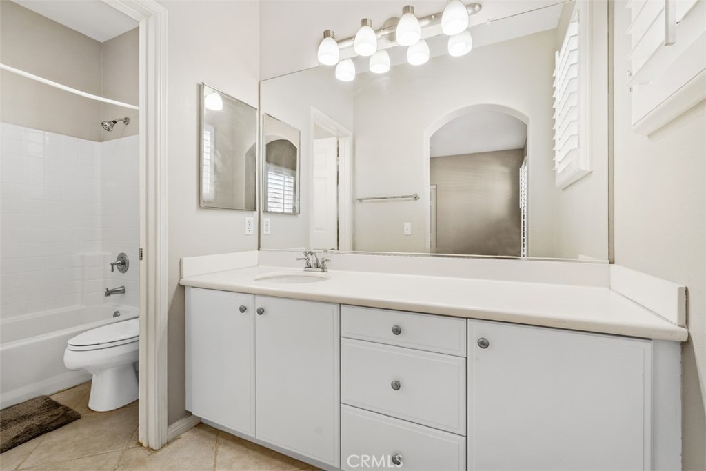 61 Burlingame Irvine, CA 92602 - Photo 12 of 13 a bathroom with a double vanity sink mirror and toilet