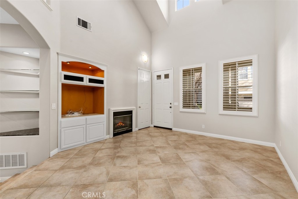 61 Burlingame Irvine, CA 92602 - Photo 4 of 13 a view of an empty room with a window