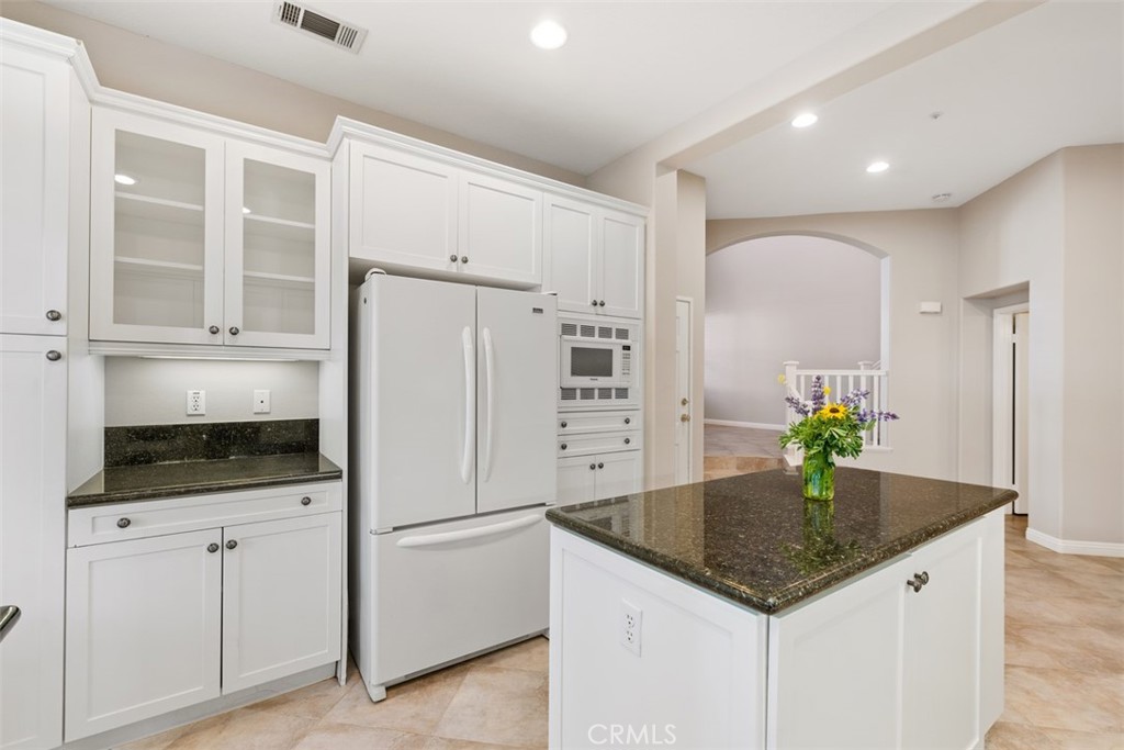 61 Burlingame Irvine, CA 92602 - Photo 7 of 13 a kitchen with stainless steel appliances a microwave sink and refrigerator