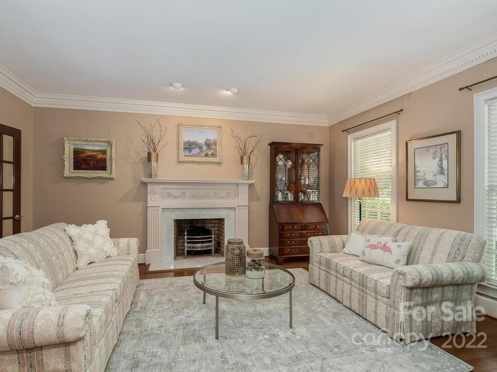 4510 Nora's Path Road Charlotte, NC 28226 - Photo 6 of 38 a living room with furniture and a fireplace
