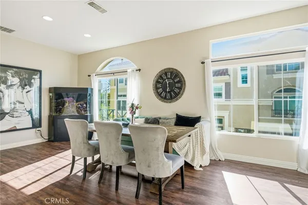 a view of a dining room with furniture window and wooden floor