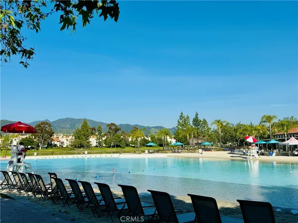 a view of swimming pool with outdoor seating and plants