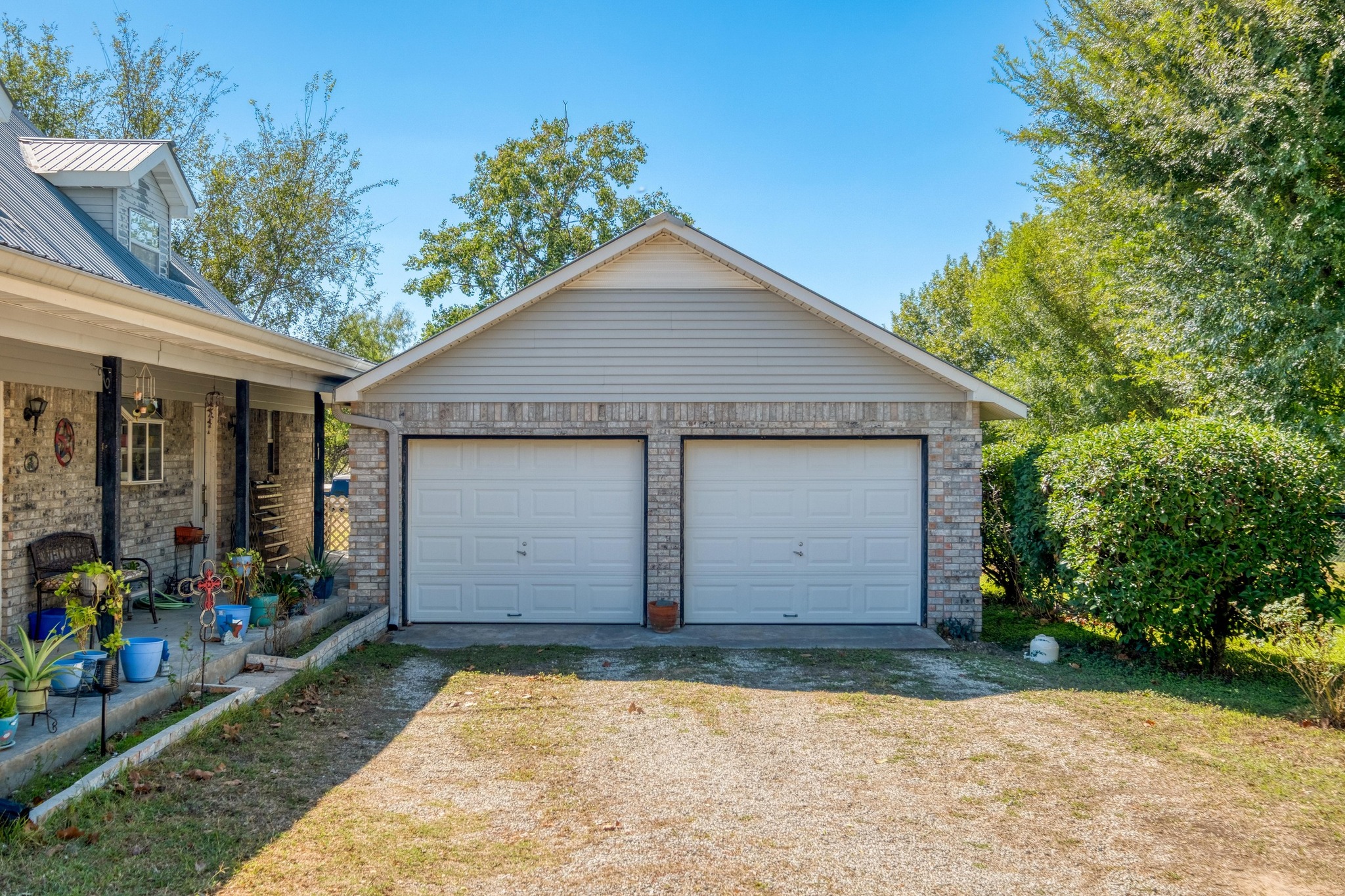 153 Pleasant Grove Road Elgin, TX 78621 - Photo 4 of 34 View of detached garage