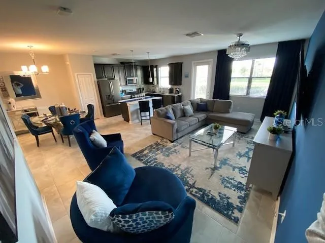 a living room with furniture and a rug