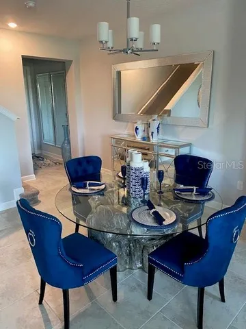 a bed room with a bed and a chair