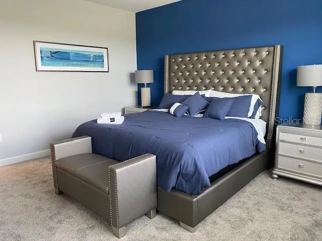 a bedroom with a bed and dresser