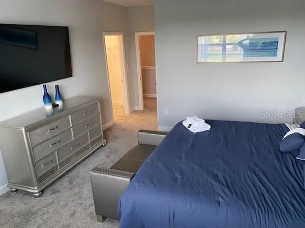 a bathroom with a tub a sink and a window