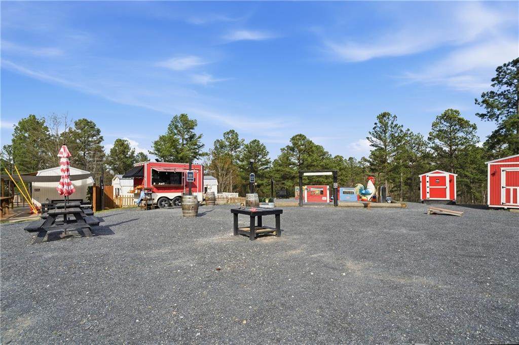 0 McPherson Church Road Dallas, GA 30132 - Photo 11 of 11 a bench is sitting in middle of a road