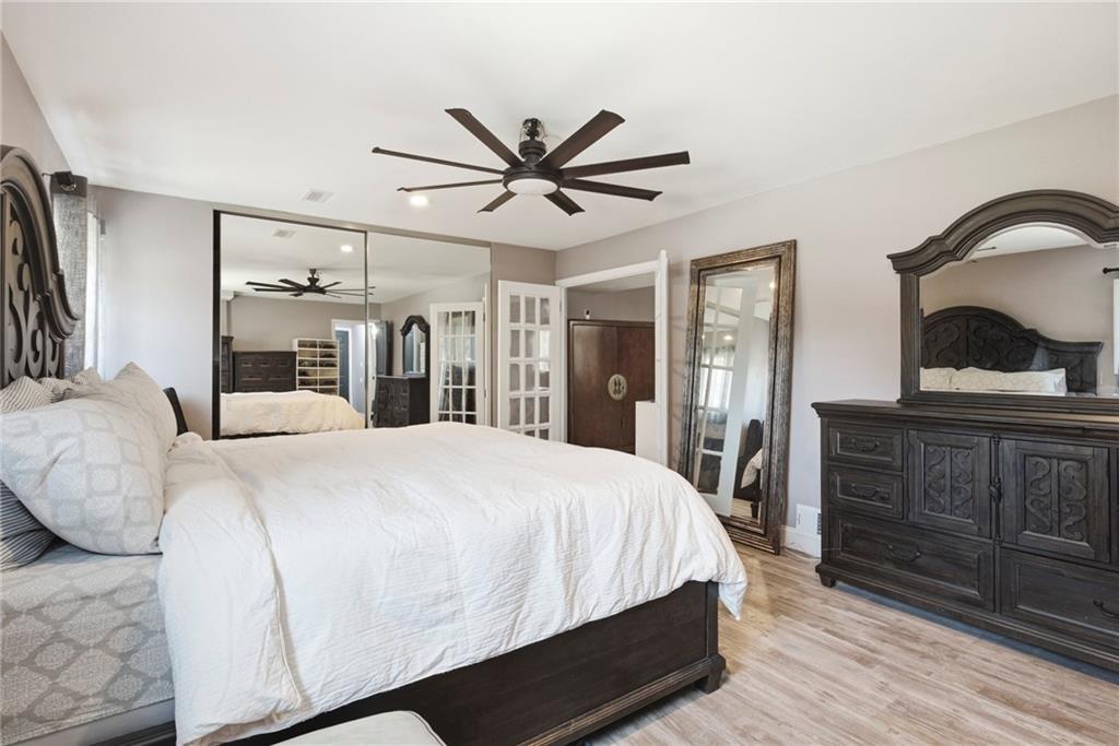 2470 Northbrook Road Snellville, GA 30039 - Photo 13 of 29 a bedroom with a large bed and dresser