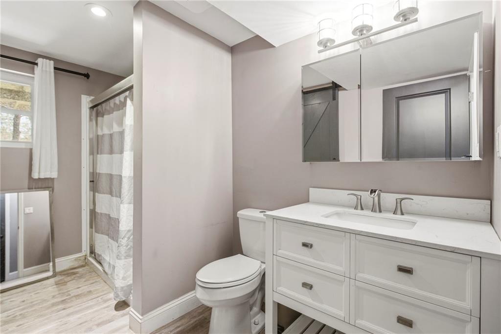 2470 Northbrook Road Snellville, GA 30039 - Photo 16 of 29 a bathroom with a sink and a mirror
