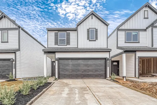 a front view of a house with yard