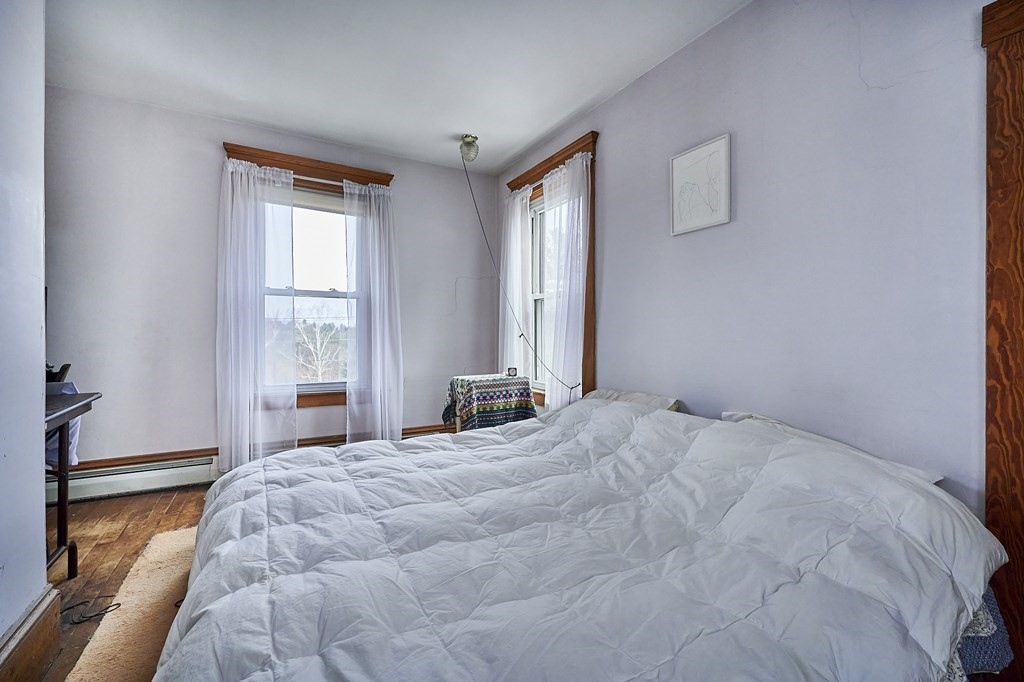 211 Greenfield Road Colrain, MA 01340 - Photo 14 of 34 a bedroom with a bed and window