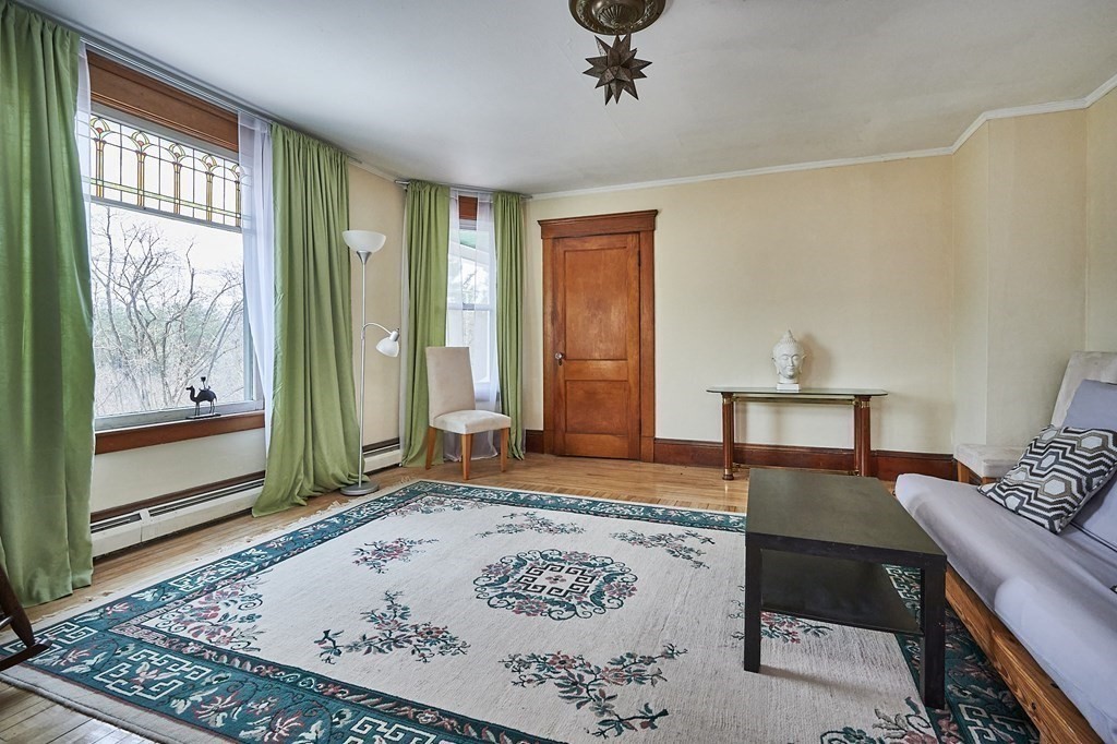 211 Greenfield Road Colrain, MA 01340 - Photo 18 of 34 a living room with furniture and a window