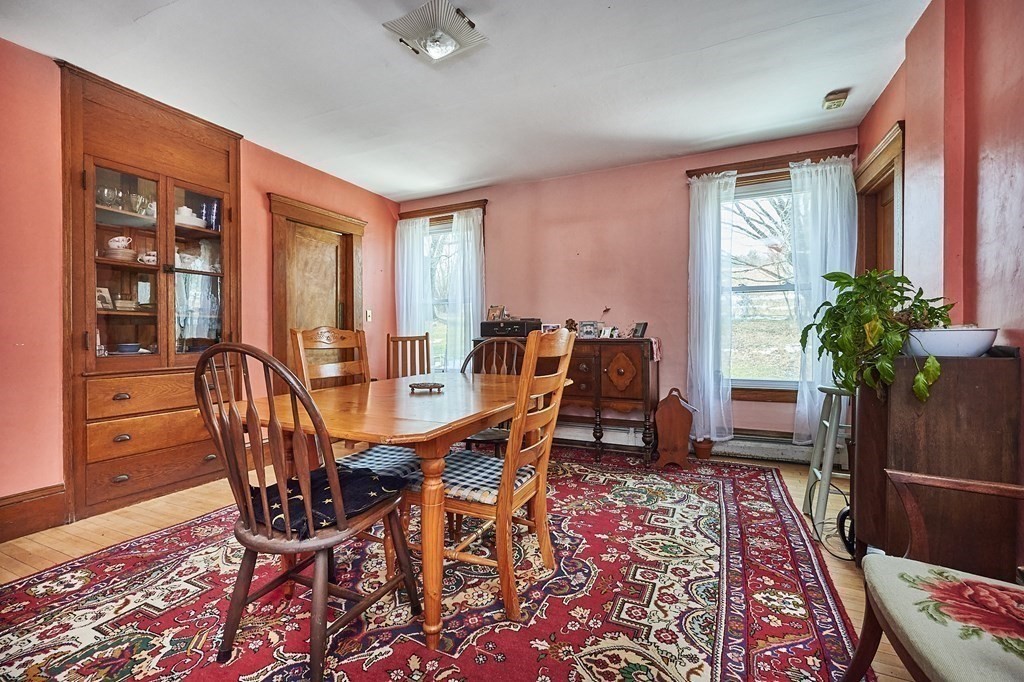 211 Greenfield Road Colrain, MA 01340 - Photo 9 of 34 a view of a dining room with furniture window and wooden floor