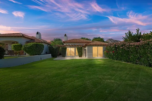 a view of a big house with a big yard