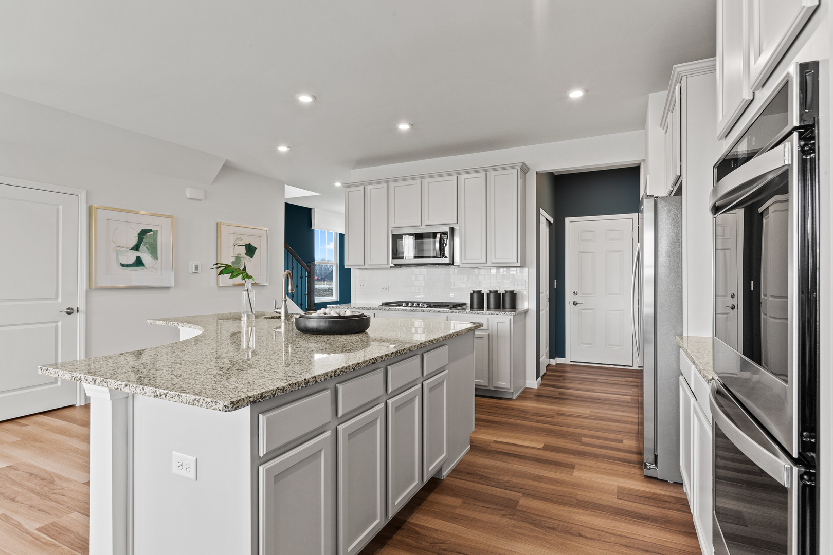 2108 Weatherbee Lane Naperville, IL 60563 - Photo 8 of 19 a kitchen with stainless steel appliances granite countertop a sink refrigerator and cabinets