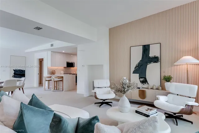 a living room with furniture and a lamp