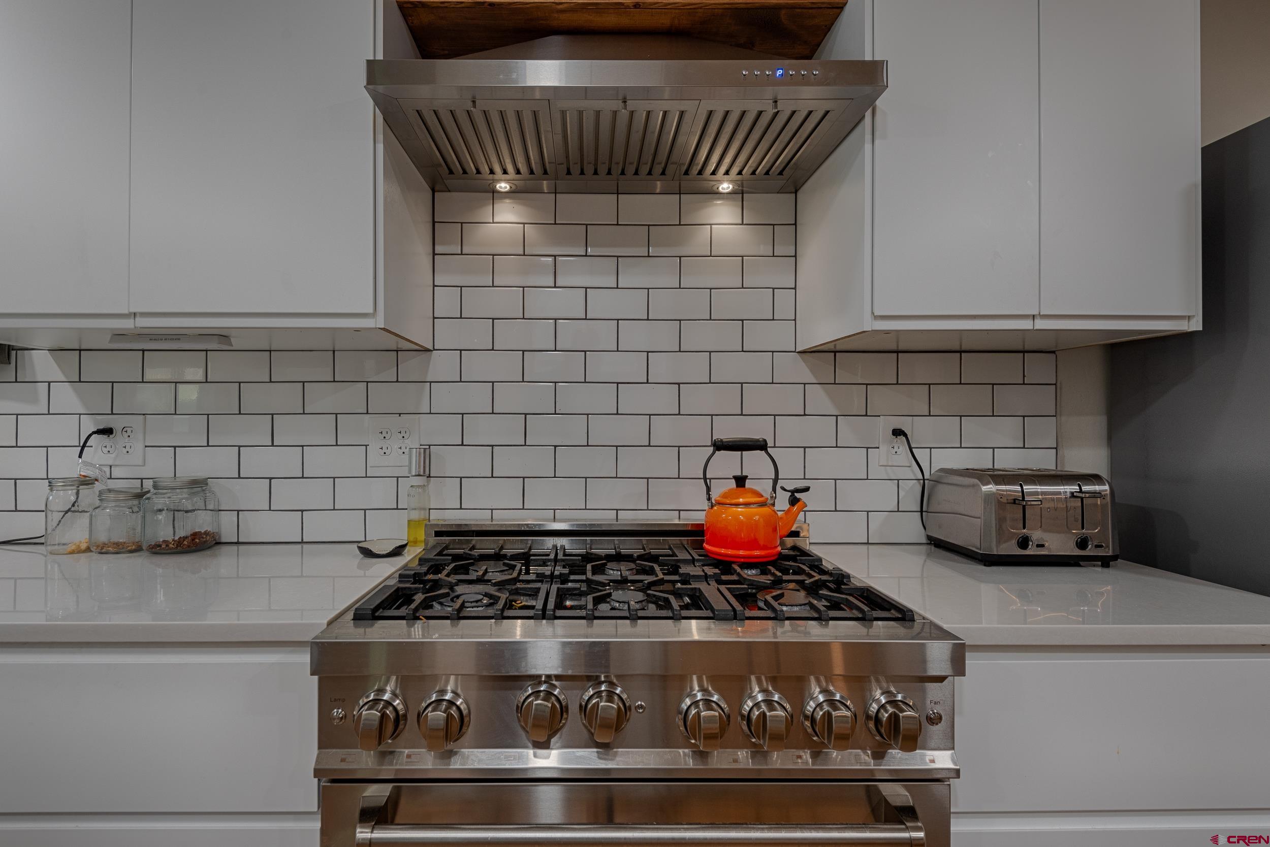 559 Suzanne Lane Ridgway, CO 81432 - Photo 5 of 45 a kitchen with a stove and cabinets