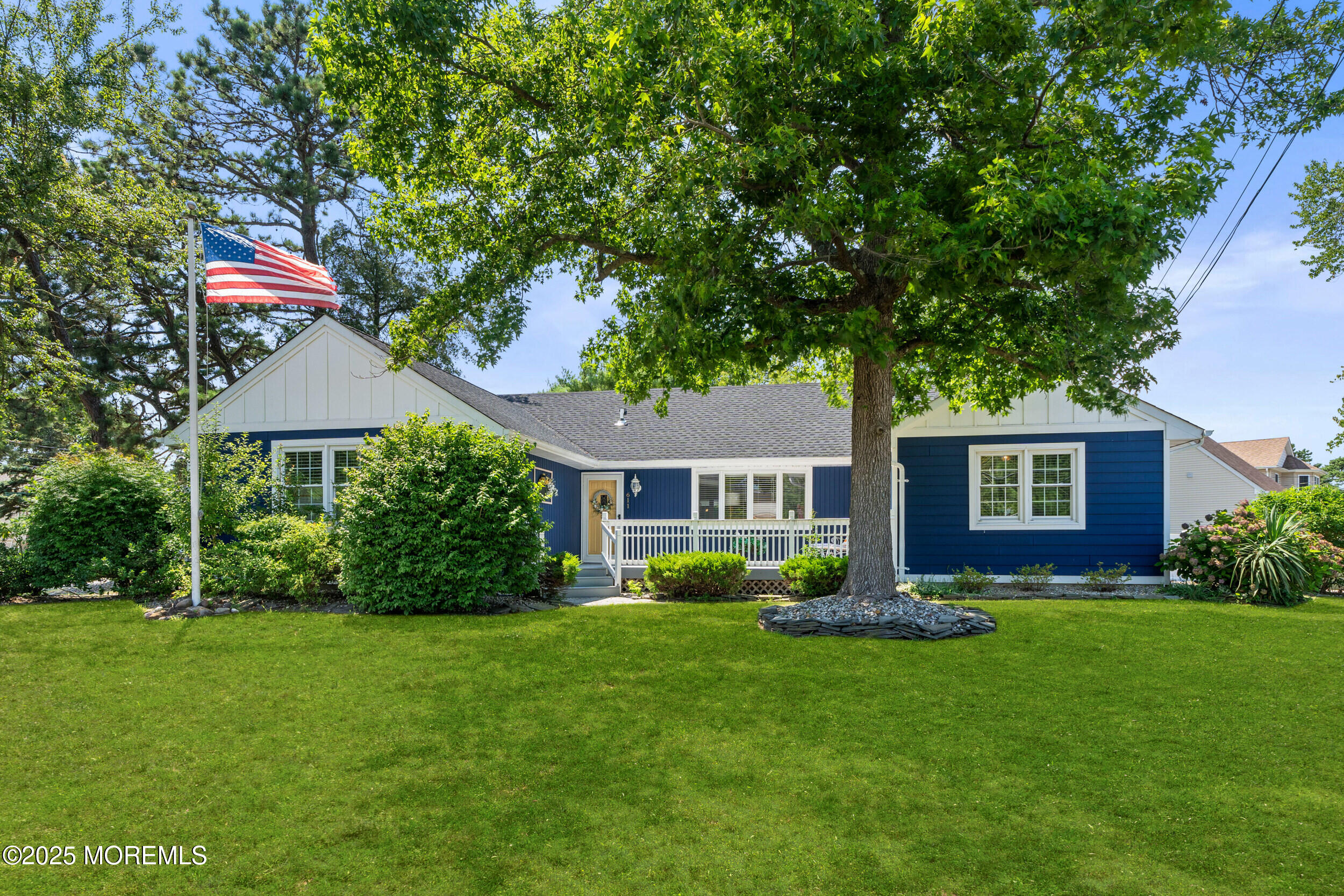 611 Drum Point Road Brick, NJ 08723 - Photo 1 of 35 a front view of a house with garden