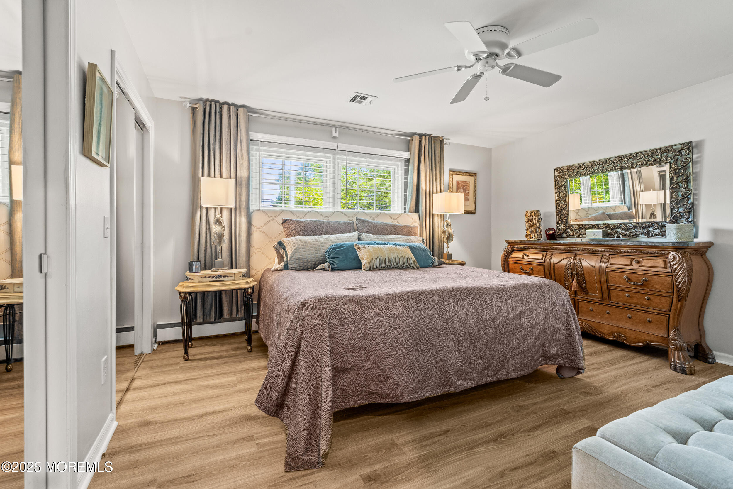 611 Drum Point Road Brick, NJ 08723 - Photo 11 of 35 a bedroom with a bed and wooden floor
