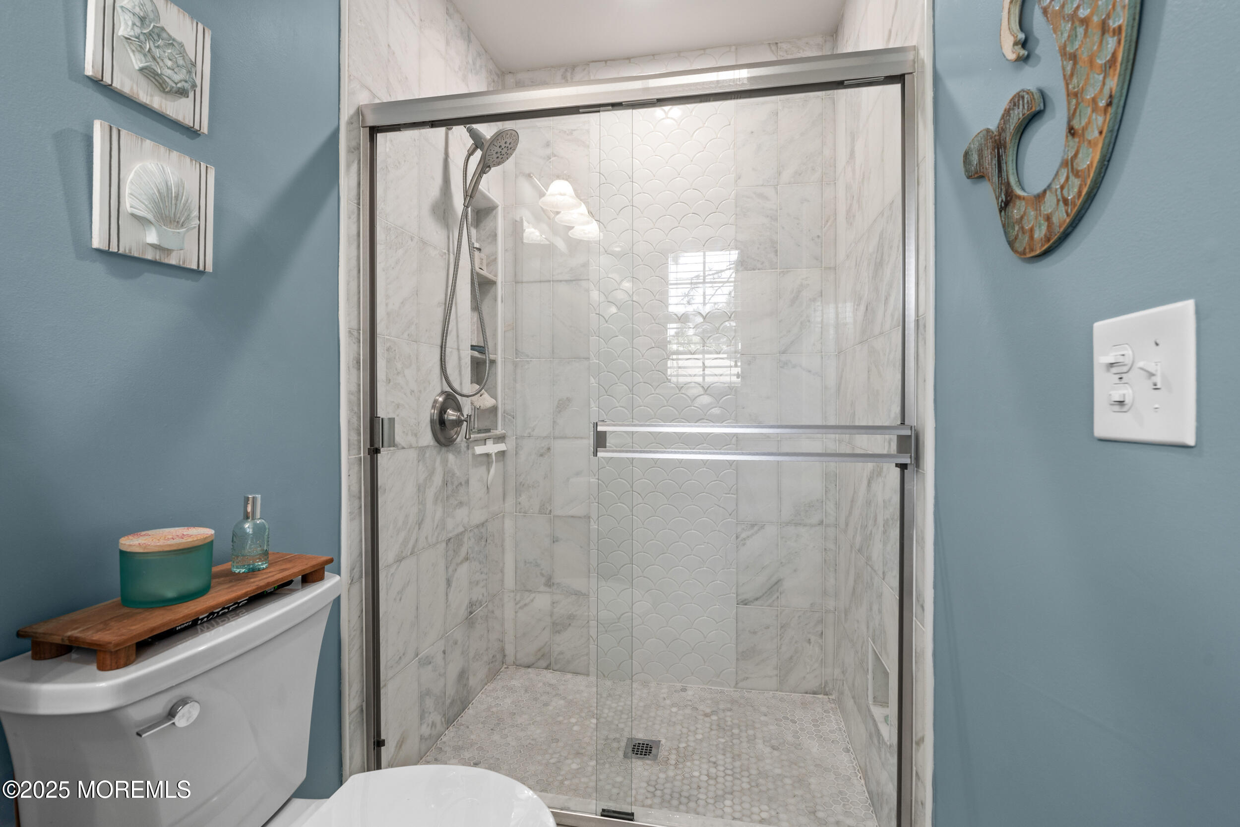 611 Drum Point Road Brick, NJ 08723 - Photo 14 of 35 a bathroom with a shower and a toilet