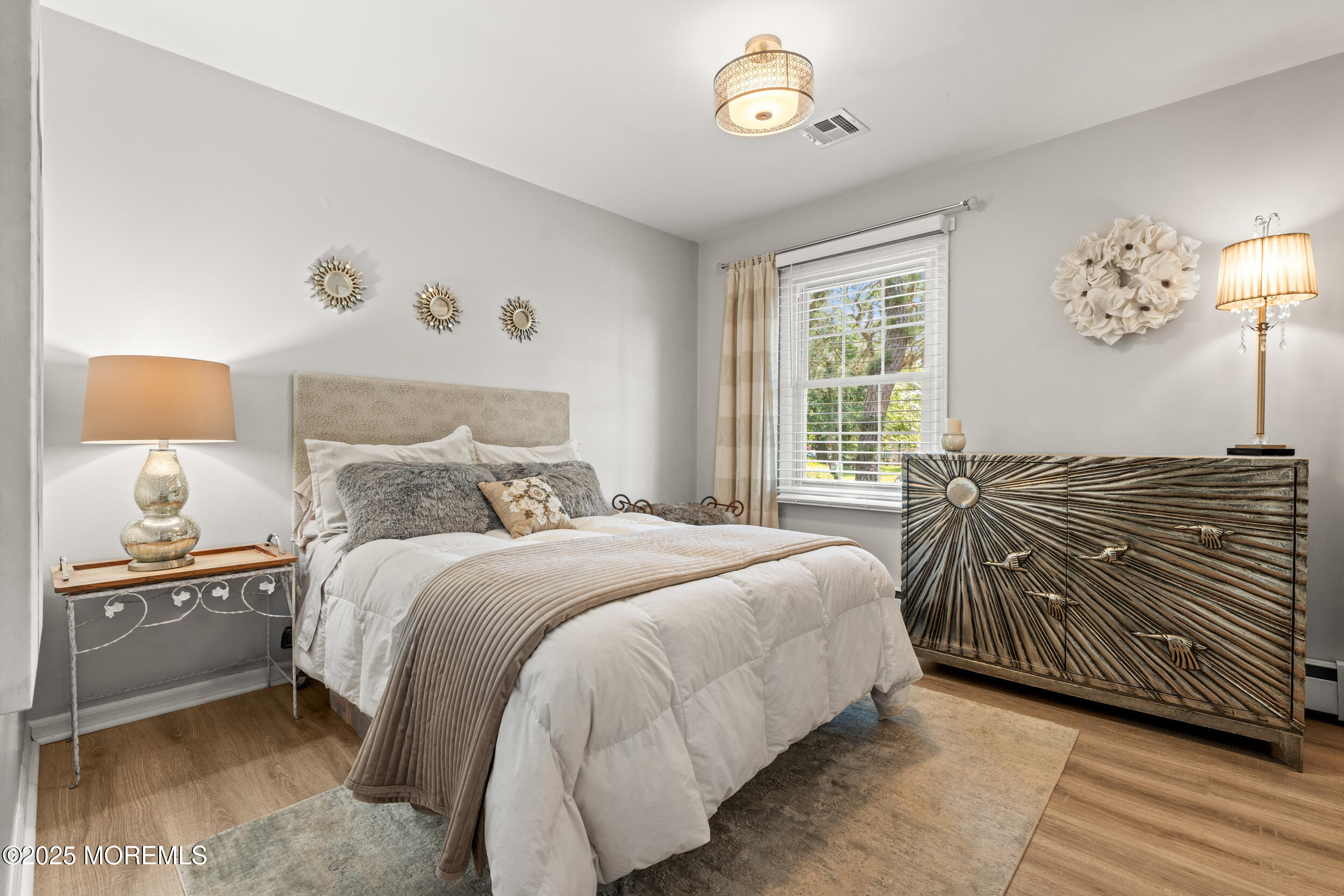 611 Drum Point Road Brick, NJ 08723 - Photo 15 of 35 a bedroom with a bed and a lamp on dresser