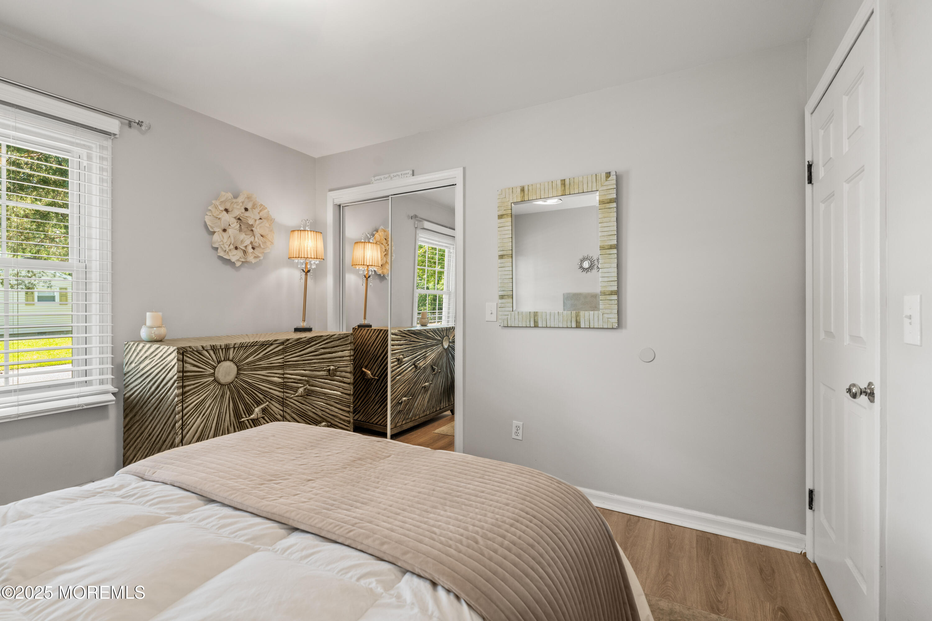 611 Drum Point Road Brick, NJ 08723 - Photo 16 of 35 a bedroom with a bed and a window
