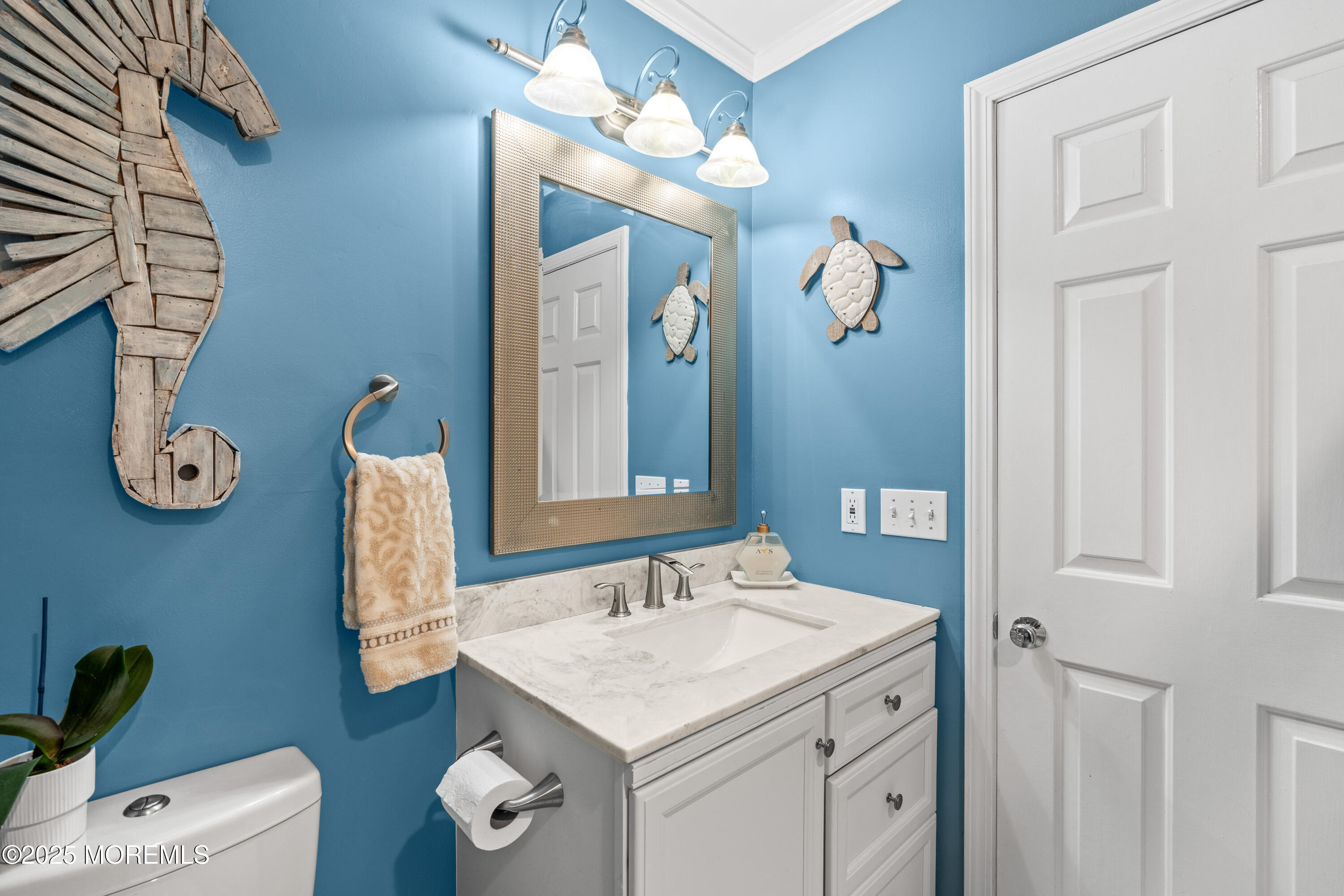 611 Drum Point Road Brick, NJ 08723 - Photo 18 of 35 a bathroom with a granite countertop sink a toilet and a mirror