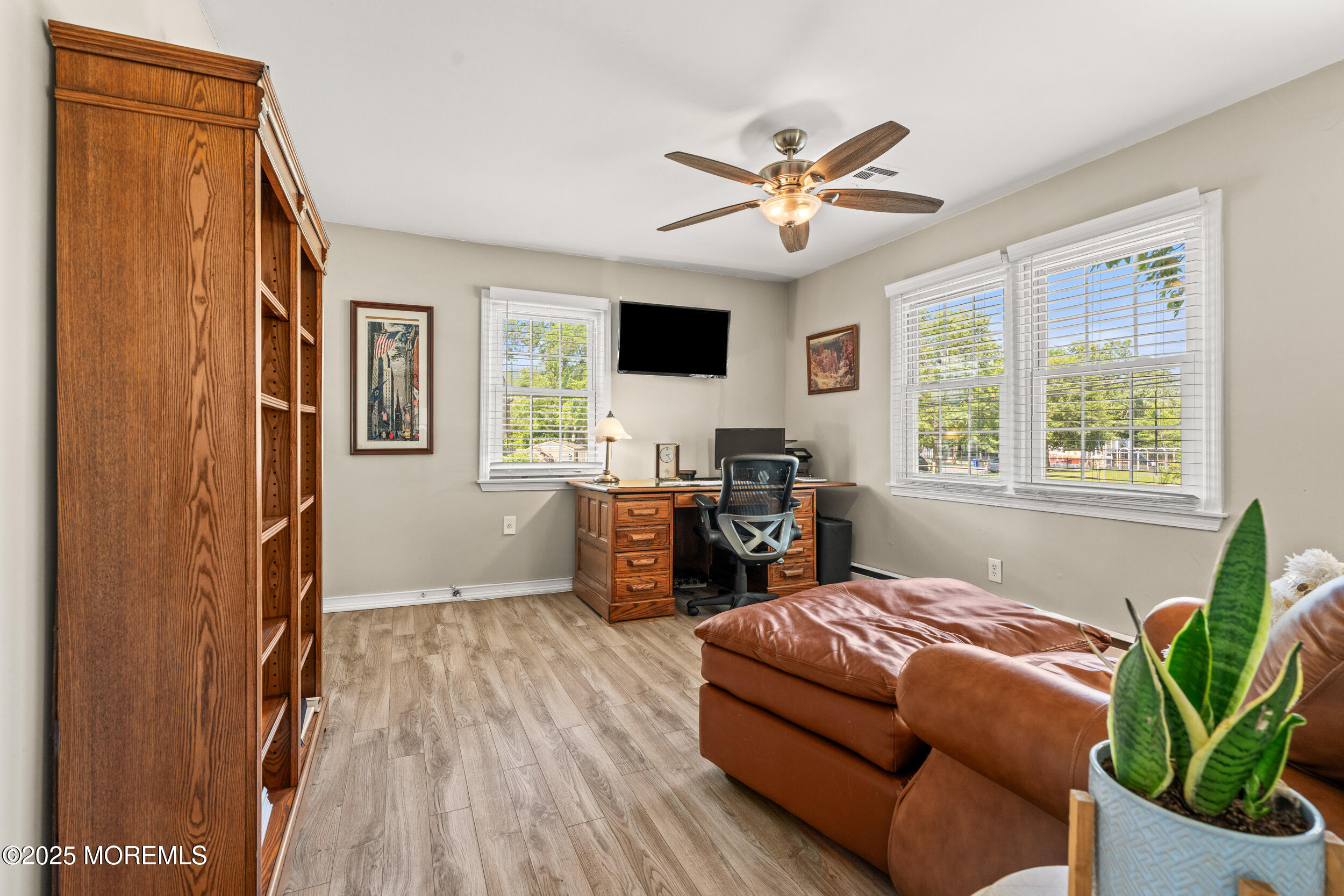 611 Drum Point Road Brick, NJ 08723 - Photo 20 of 35 a living room with furniture and a flat screen tv