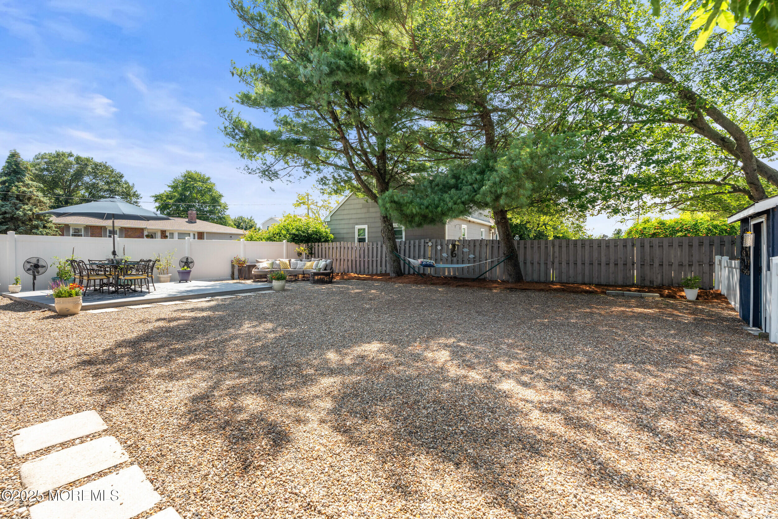 611 Drum Point Road Brick, NJ 08723 - Photo 26 of 35 a view of a back yard of the house