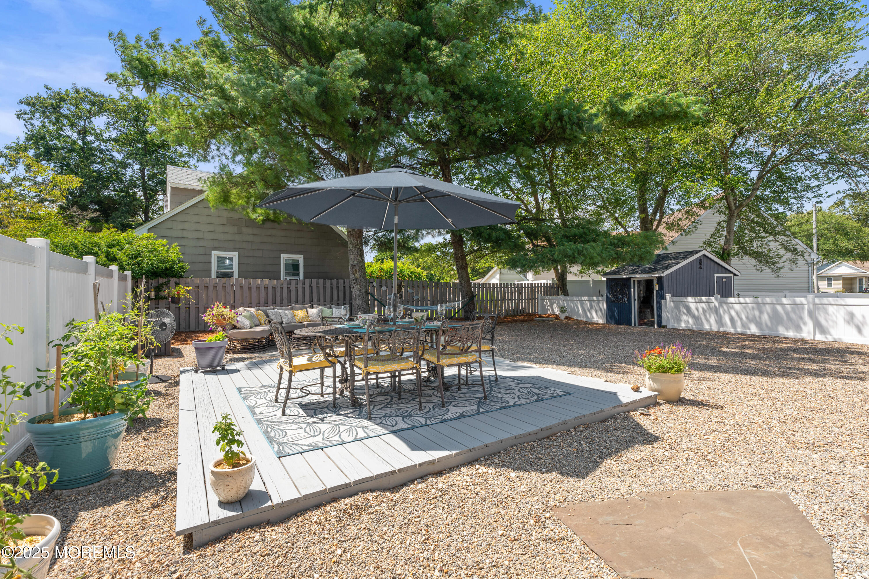 611 Drum Point Road Brick, NJ 08723 - Photo 27 of 35 a view of outdoor space yard deck patio and outdoor kitchen