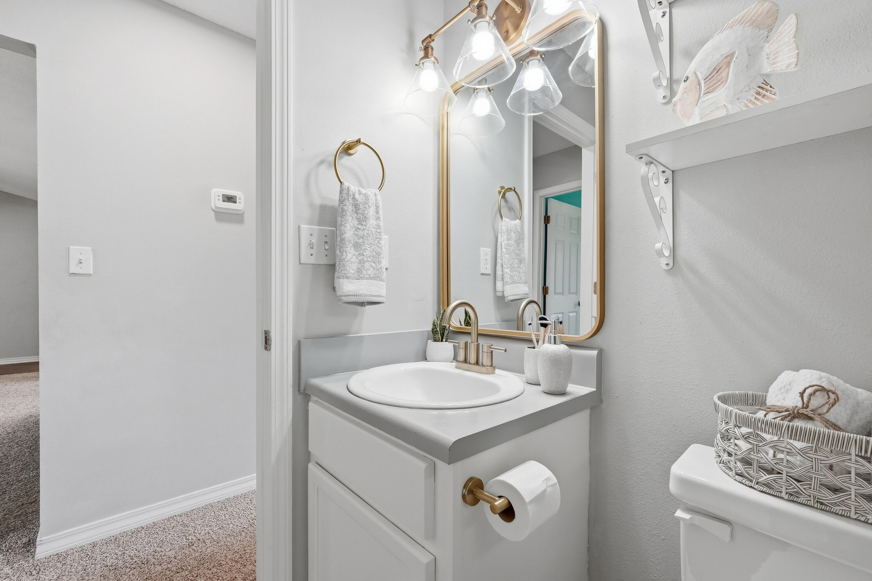 3033 Cabela Lane Crestview, FL 32539 - Photo 23 of 32 a bathroom with a sink and a mirror