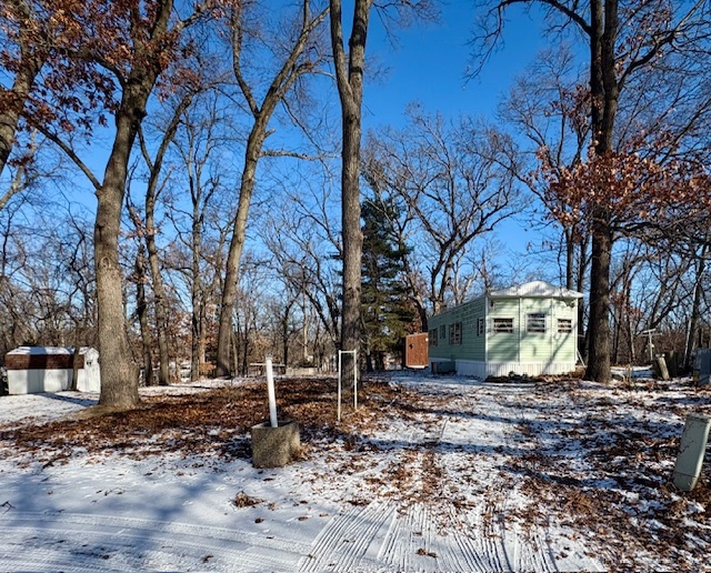 a backyard of a house with large trees