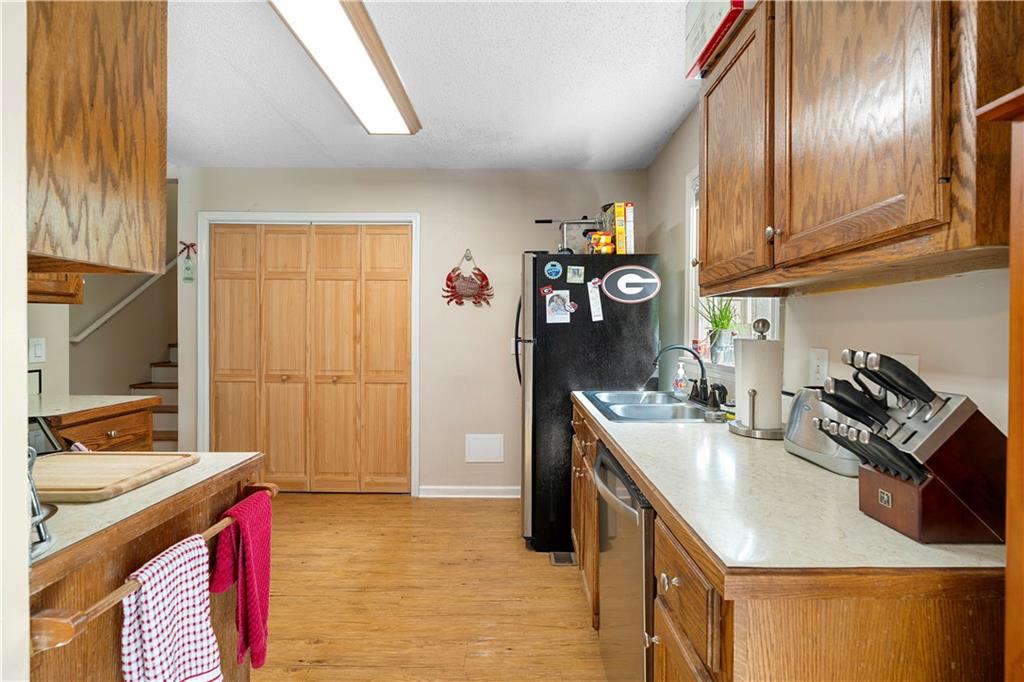 30 Azalea Drive Southeast Cartersville, GA 30121 - Photo 13 of 35 a kitchen with stainless steel appliances granite countertop a sink stove and refrigerator