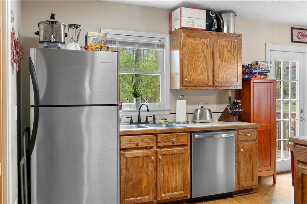 30 Azalea Drive Southeast Cartersville, GA 30121 - Photo 15 of 35 a kitchen with stainless steel appliances granite countertop a refrigerator and a sink